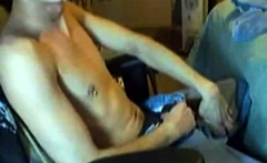 Guy jerking off at home till he cums all over his chest